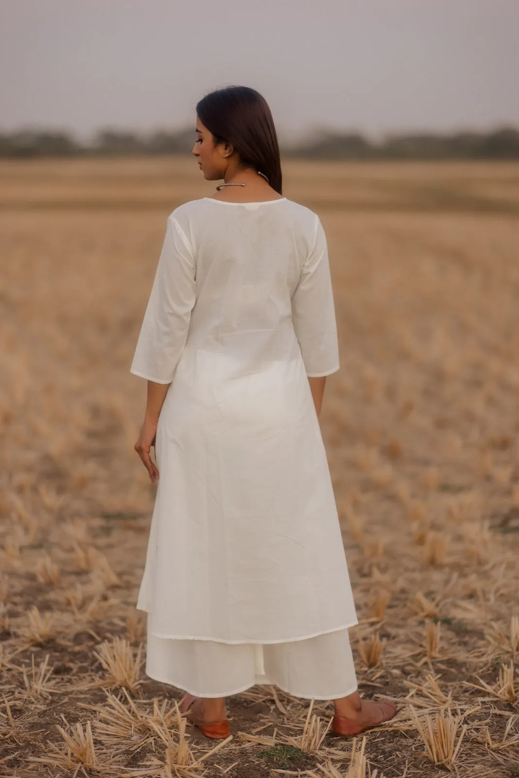 Crisp white kurta set with melon printed dupatta