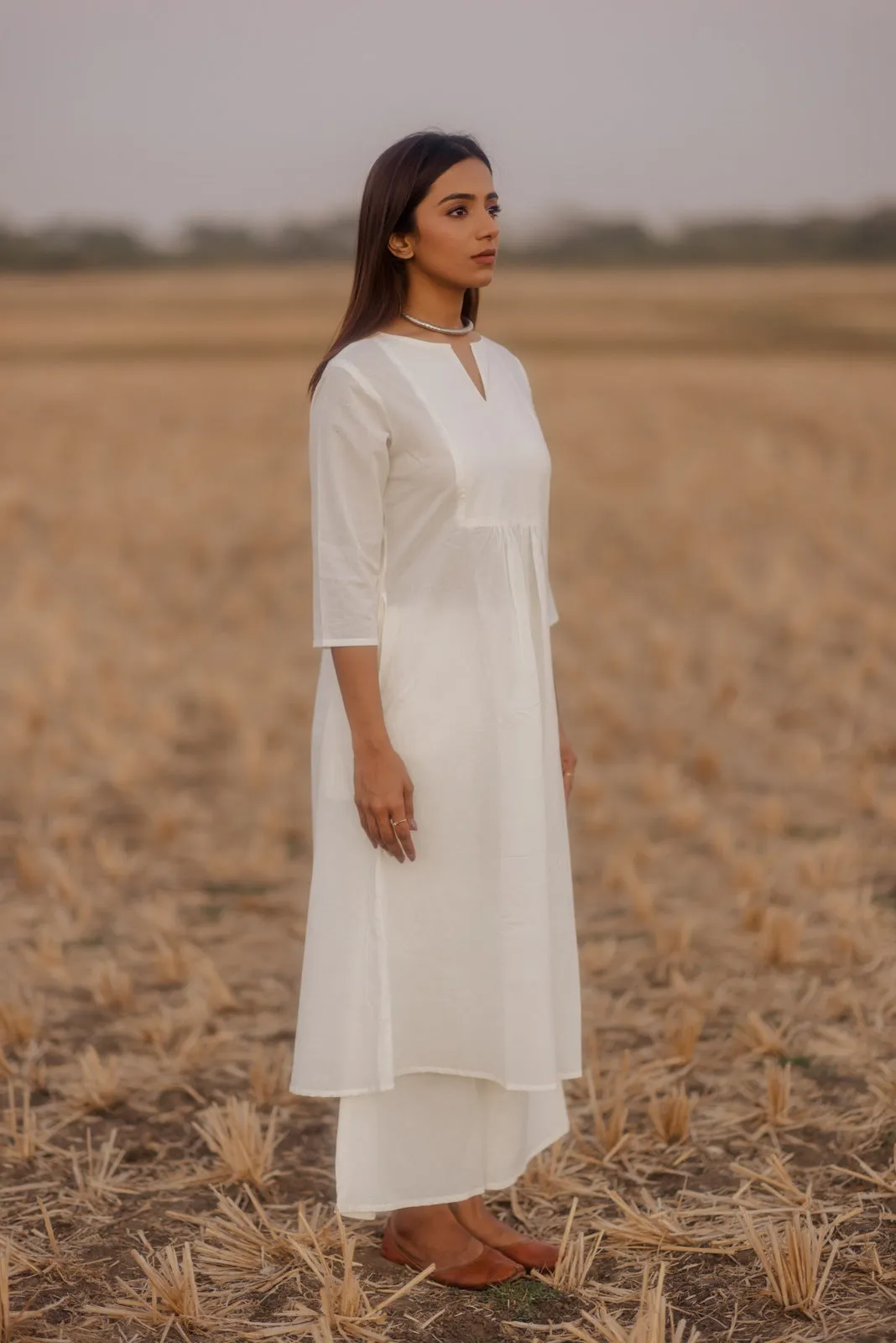 Crisp white kurta set with melon printed dupatta