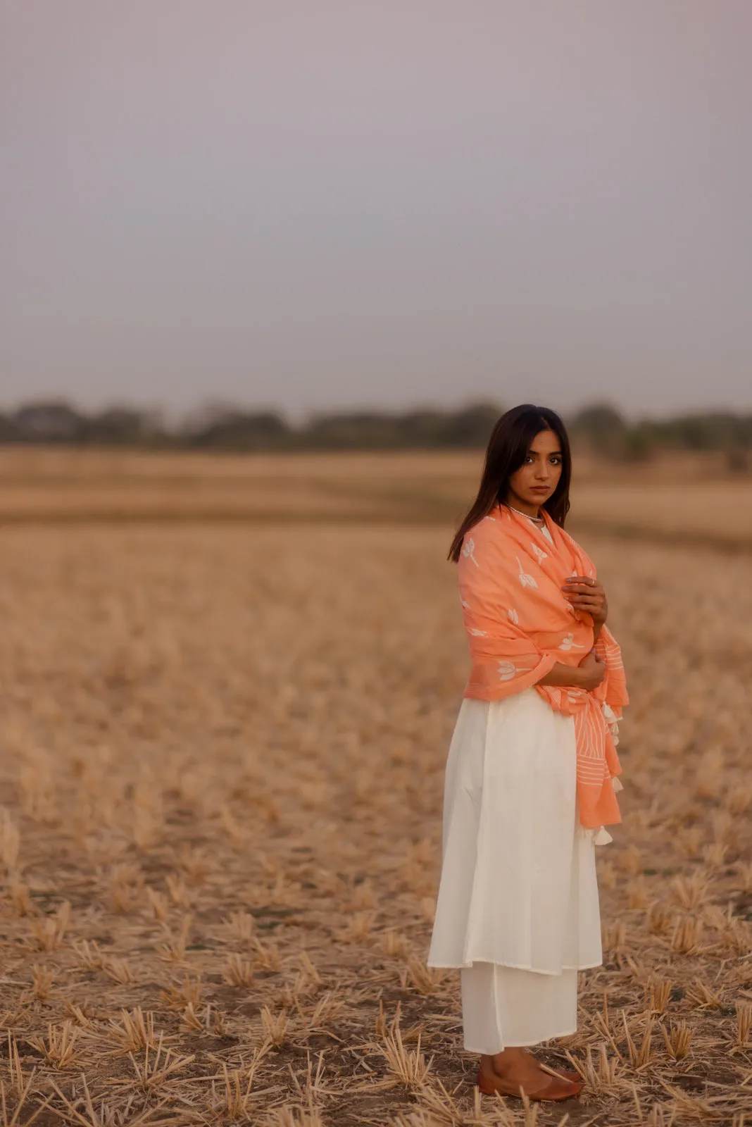 Crisp white kurta set with melon printed dupatta
