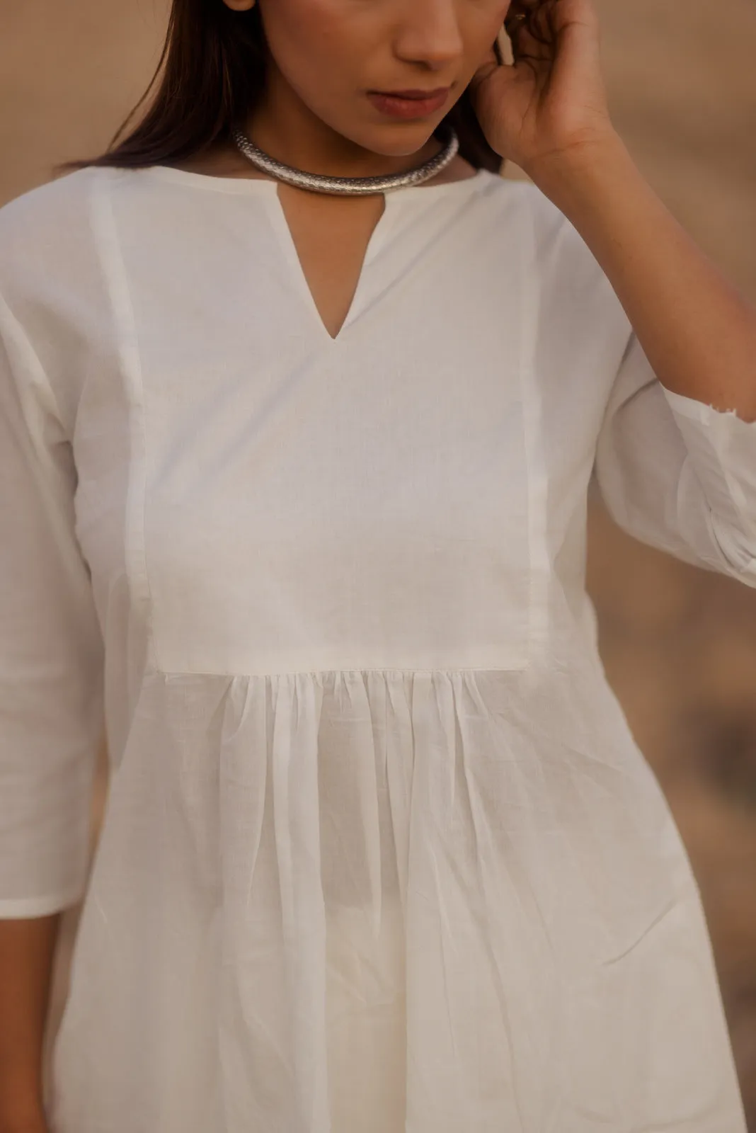 Crisp white kurta set with melon printed dupatta